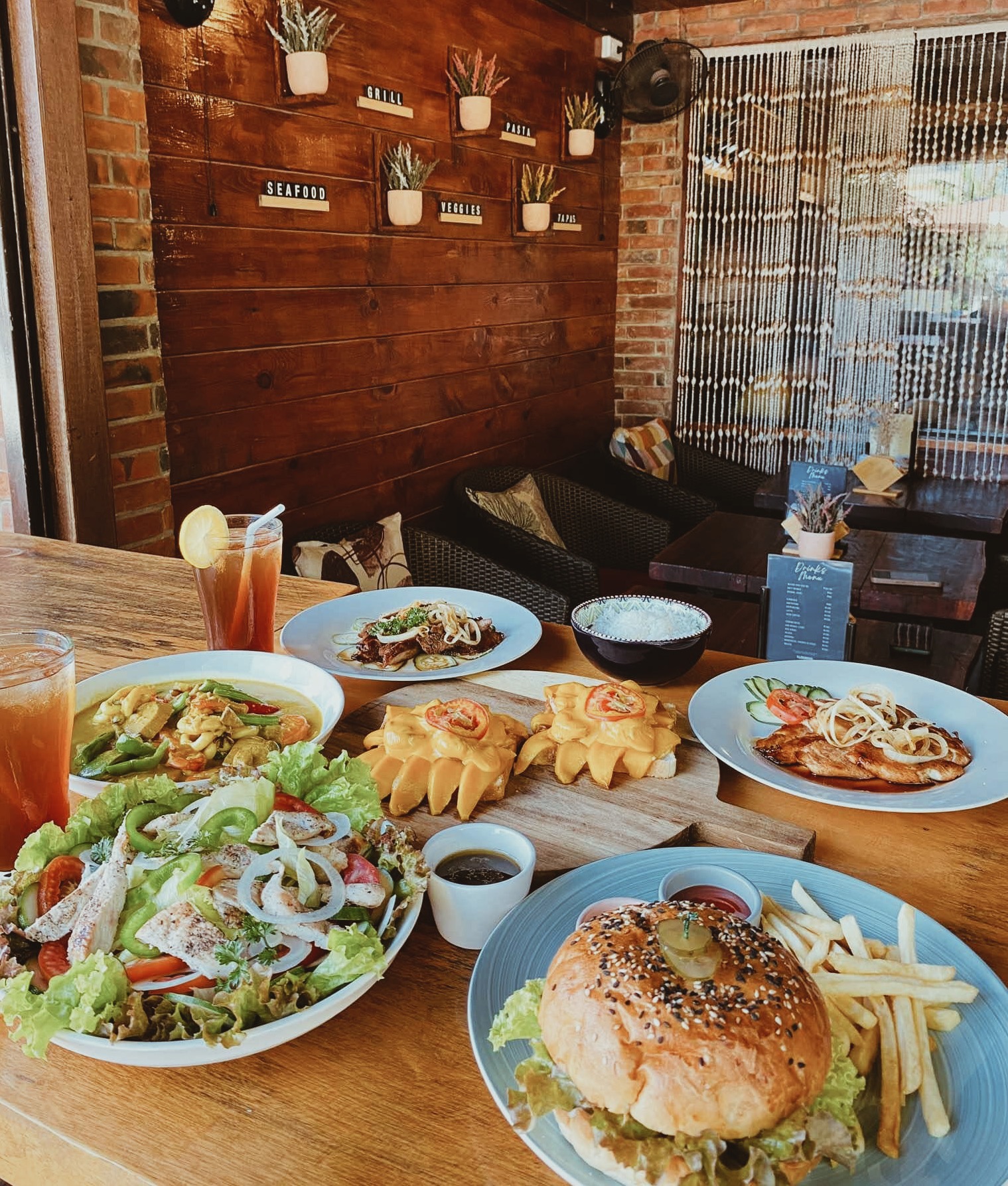 Food and drinks on a table at The Lounge in Moalboal